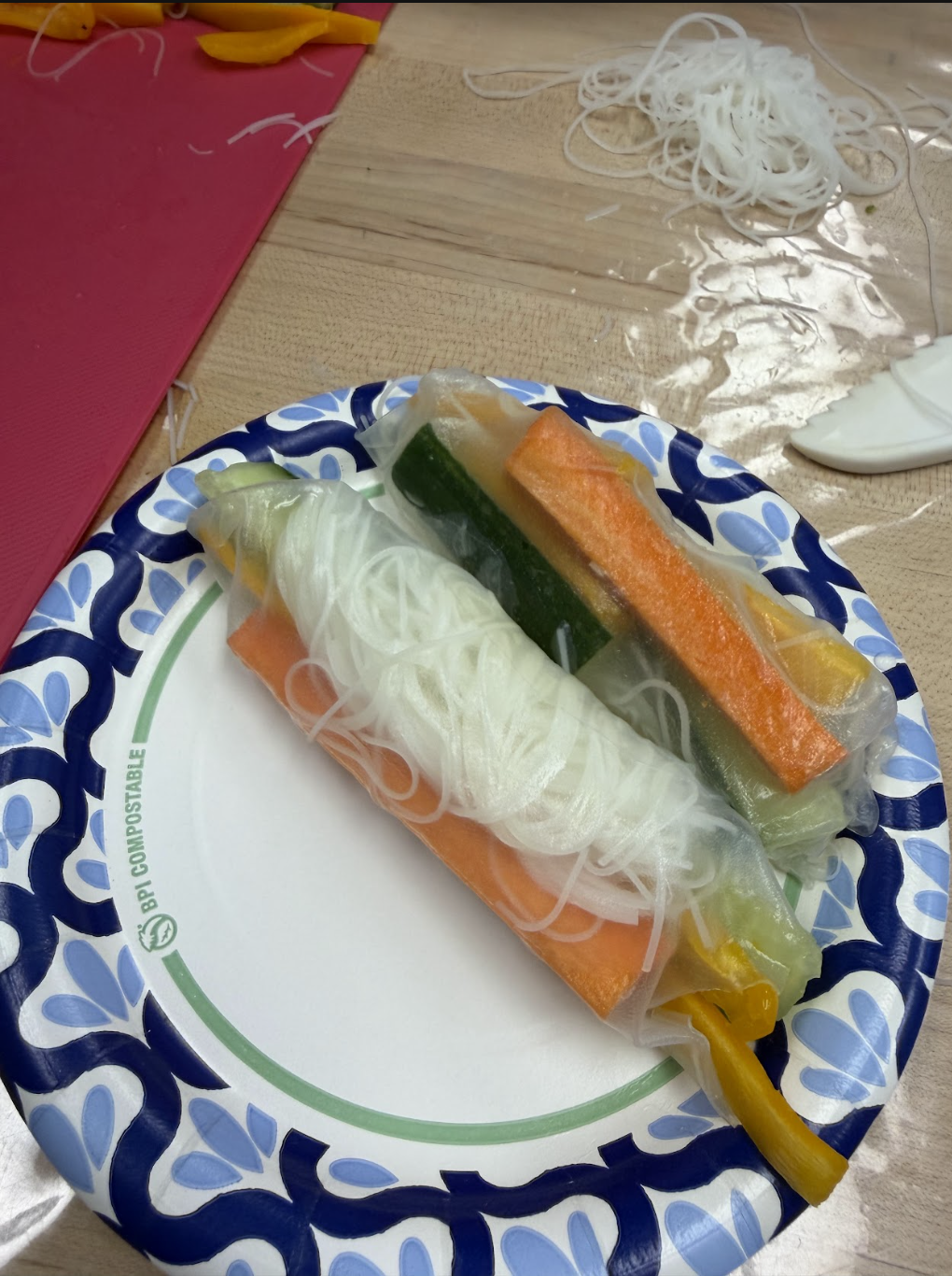 A beautifully assembled spring roll plated and ready to eat